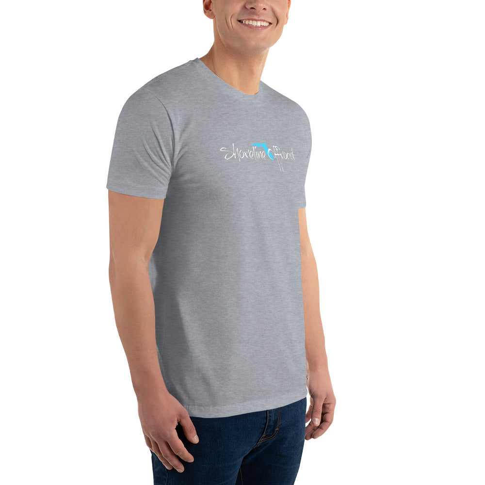 a man wearing a grey t - shirt with a blue logo