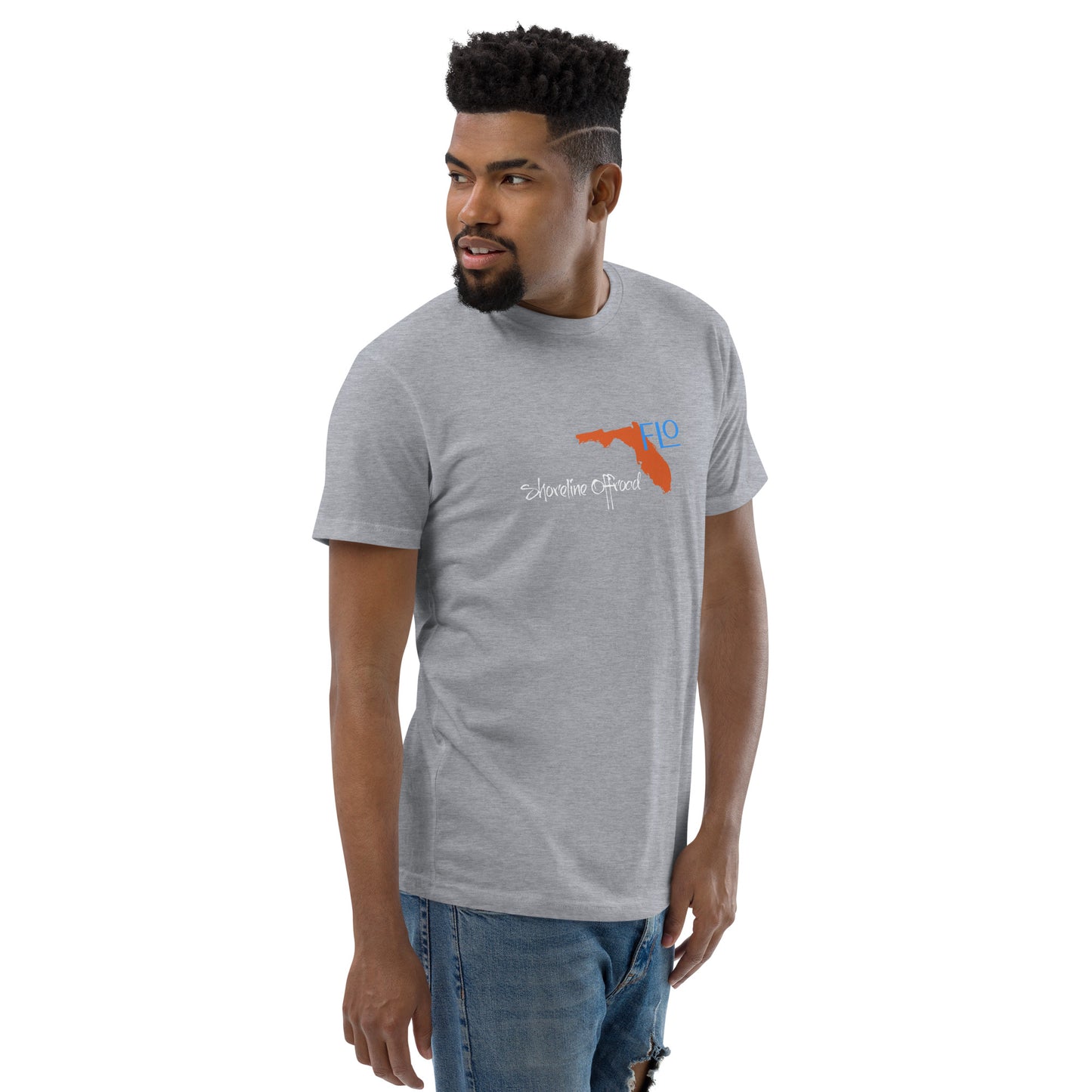 a man wearing a grey t - shirt with an orange bird on it