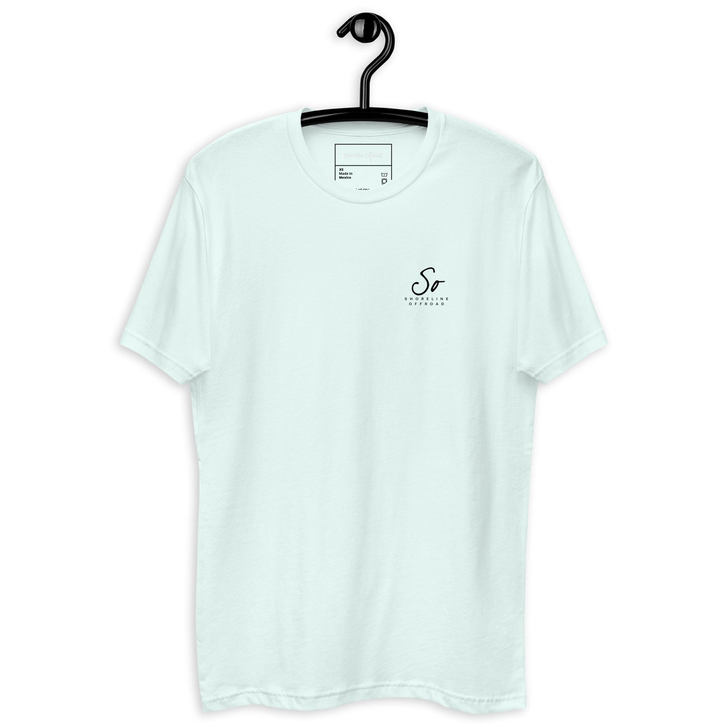 a white t - shirt hanging on a black hanger