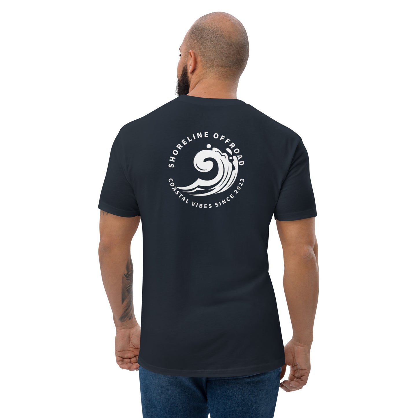 a man wearing a black shirt with a white logo on it