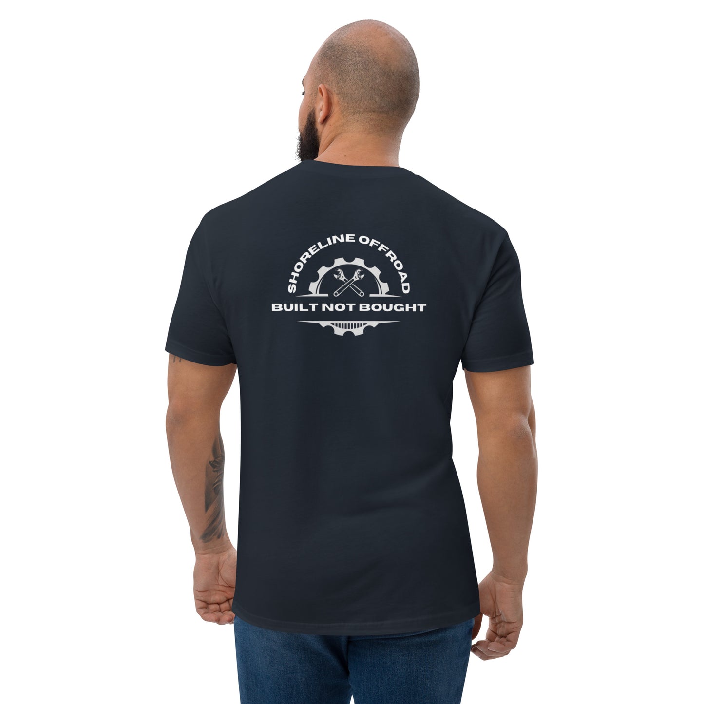 the back of a man wearing a black t - shirt