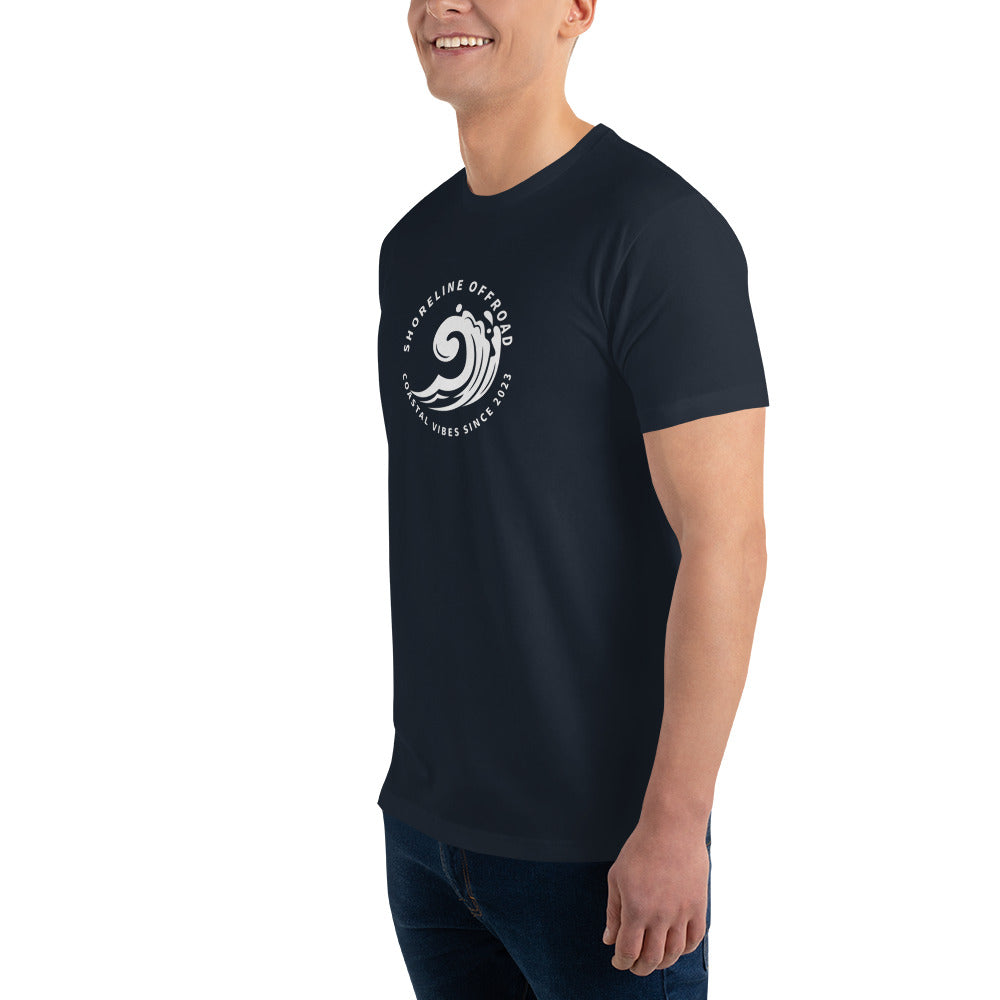 a man in a black t - shirt smiles at the camera