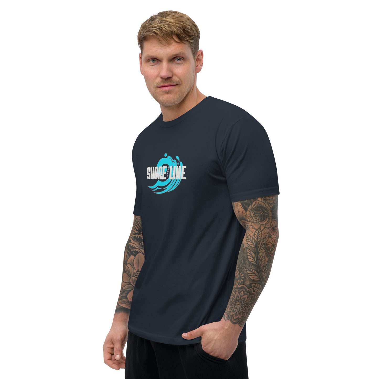 a man with a tattoo on his arm standing in front of a white background