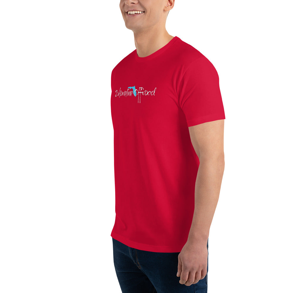 a man in a red shirt smiles at the camera