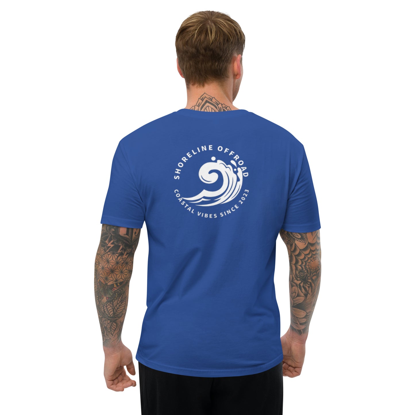 a man wearing a blue shirt with a white logo on it
