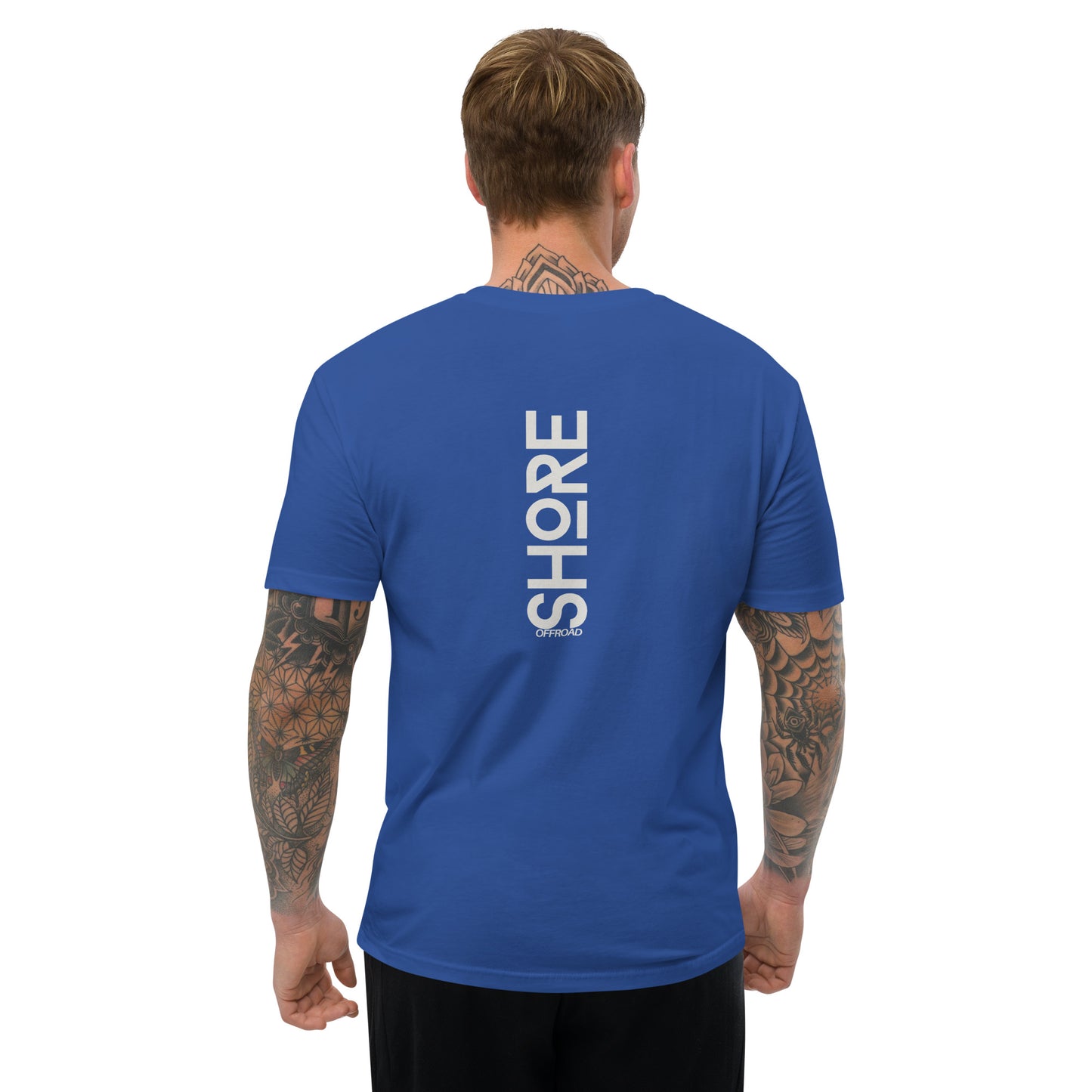 a man wearing a blue t - shirt that says shop