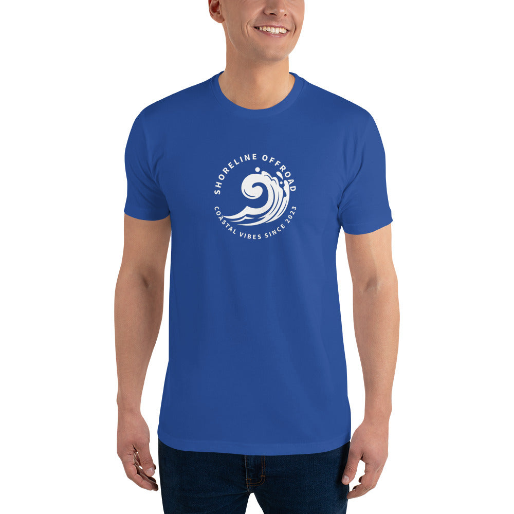 a man wearing a blue t - shirt with a white wave on it