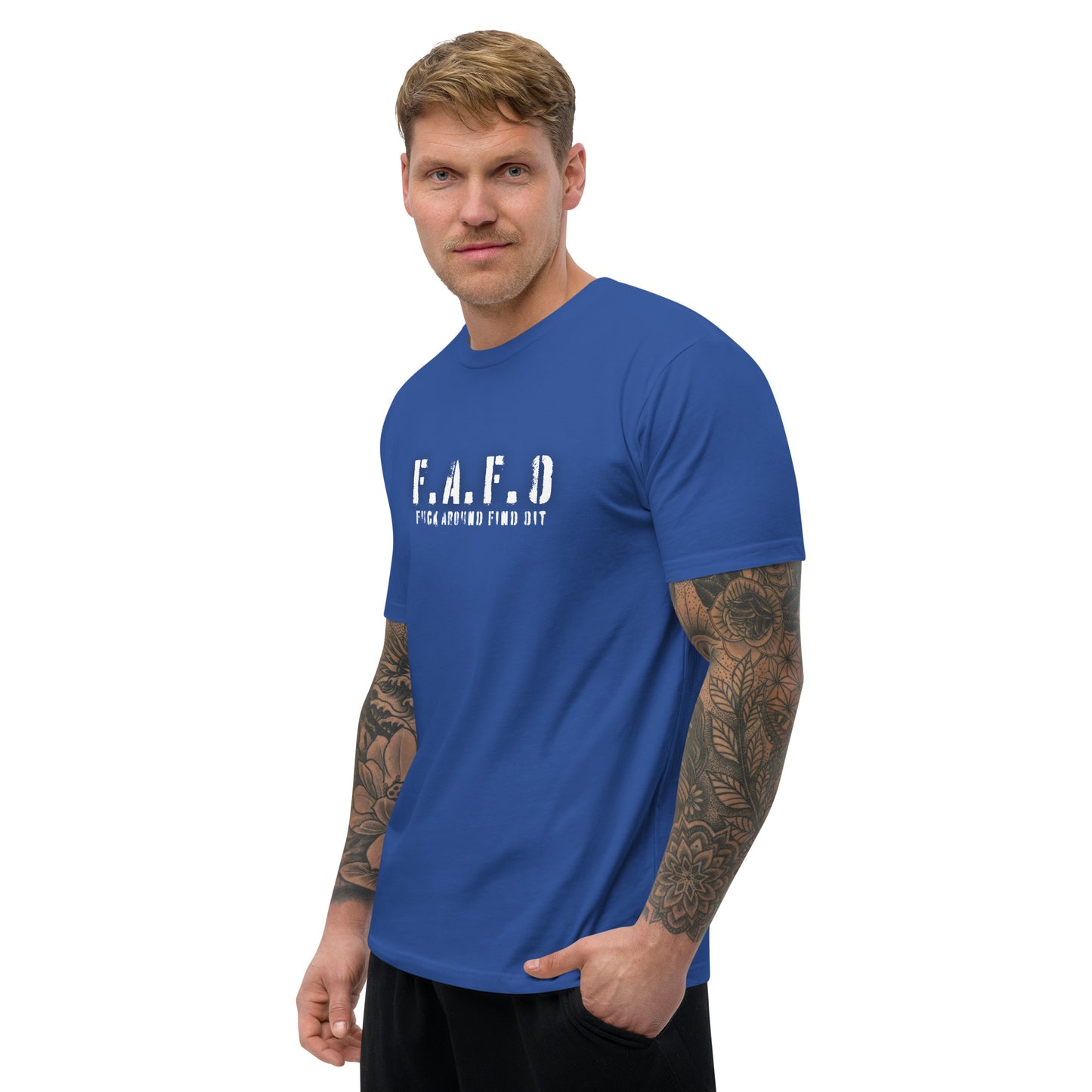 a man with a tattooed arm wearing a blue t - shirt