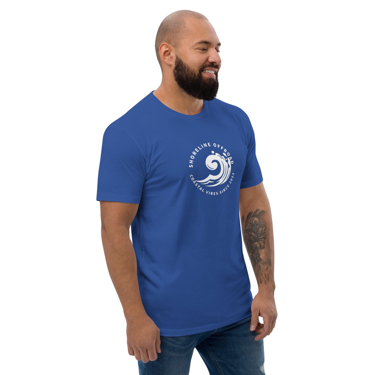 a man with a beard wearing a blue t - shirt