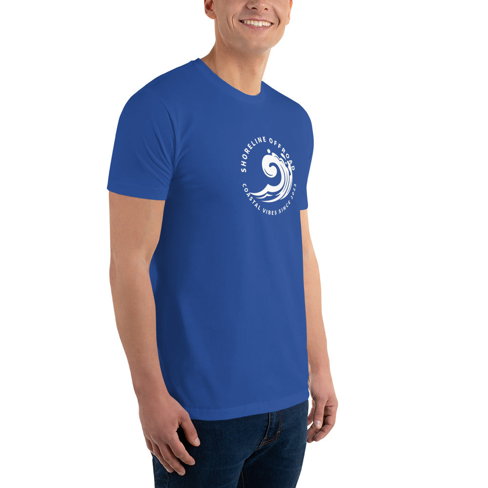 a man wearing a blue t - shirt with a white logo