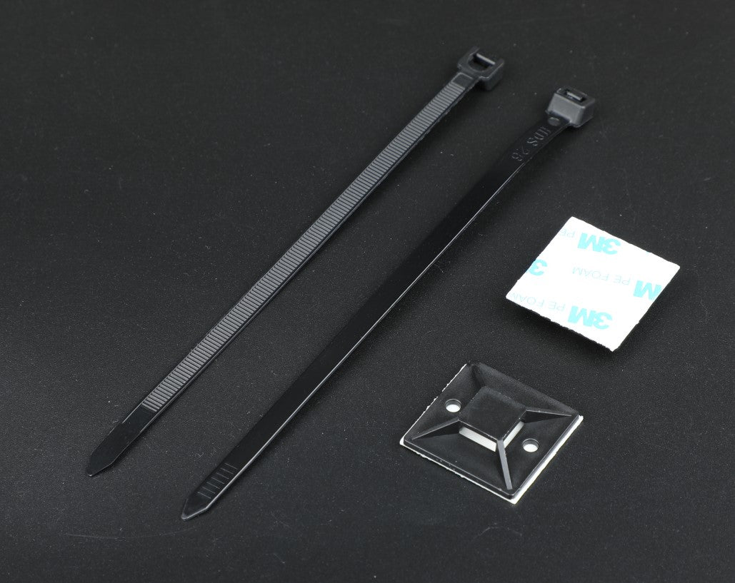 a pair of scissors and a piece of paper on a table