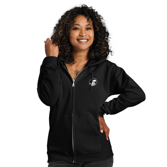 a woman wearing a black zip up hoodie