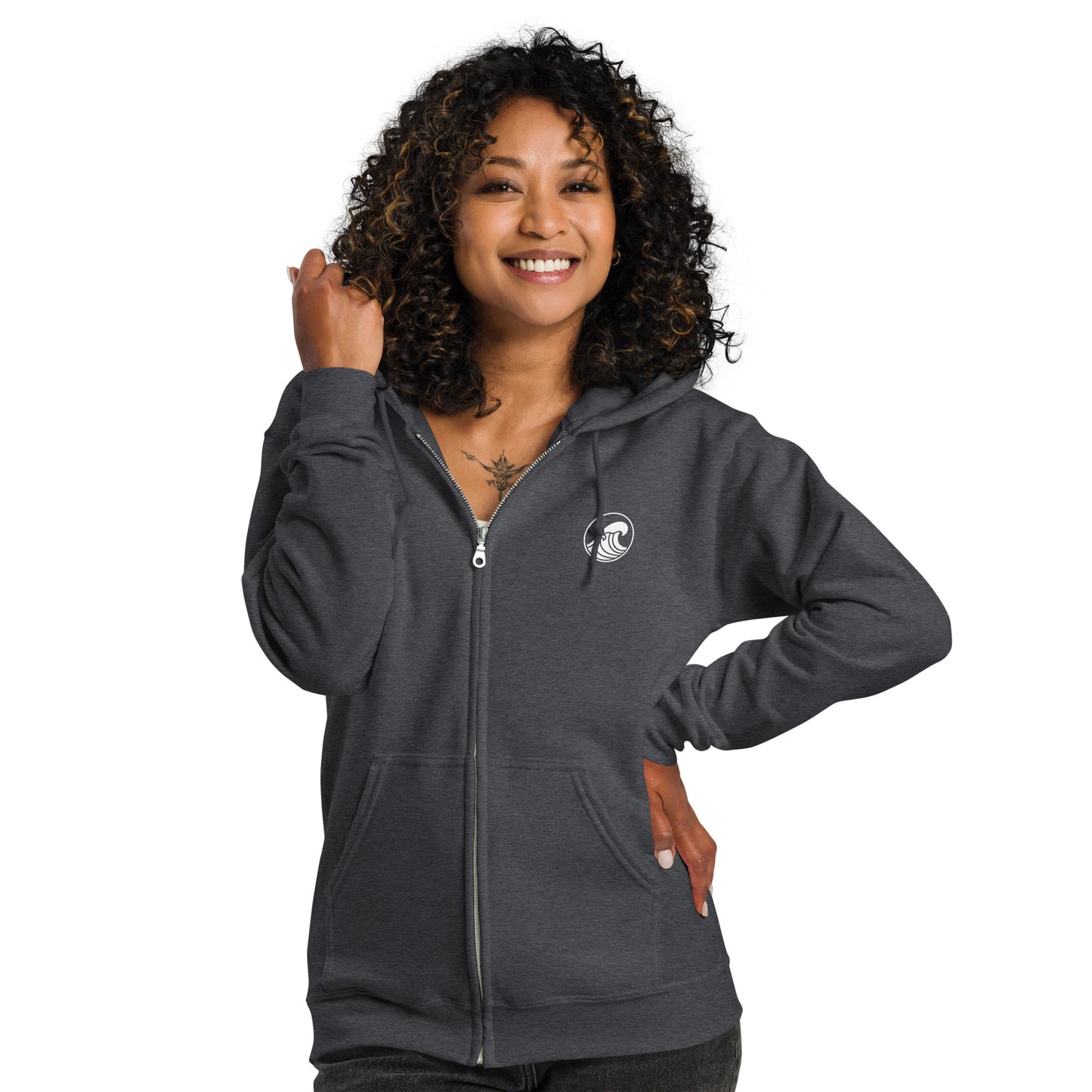 a woman wearing a gray zip up hoodie