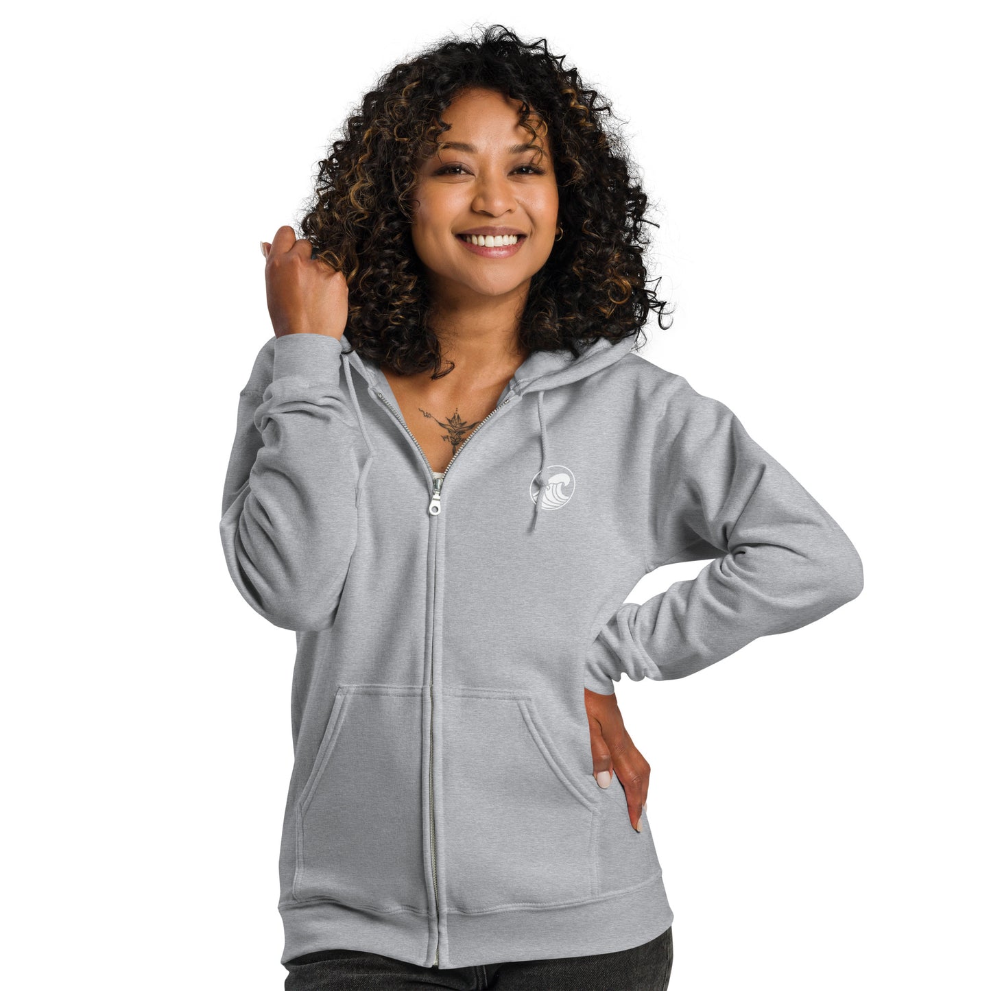 a woman wearing a grey zip up hoodie