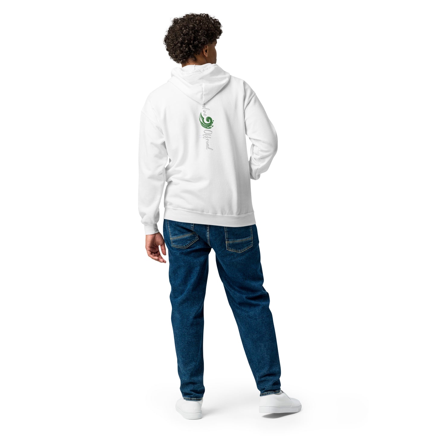a man in a white hoodie and jeans