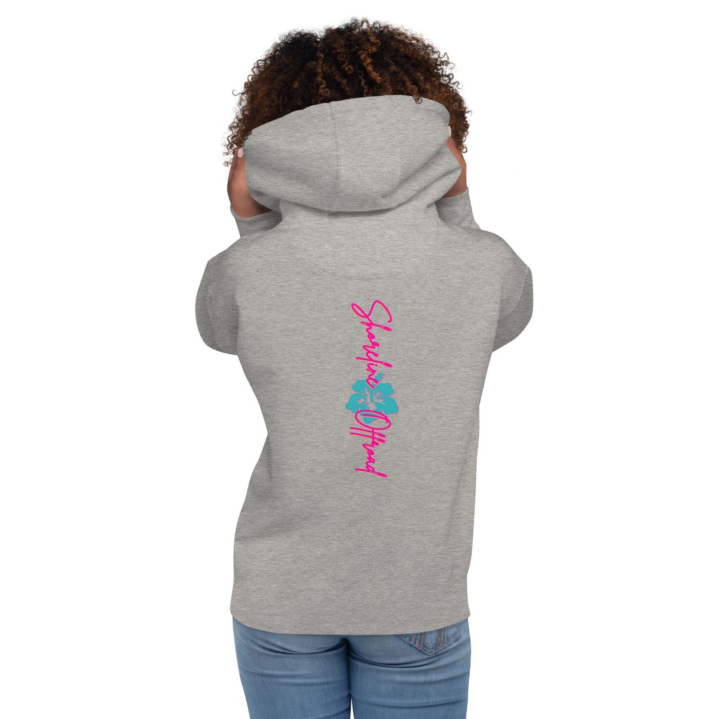 a woman wearing a grey hoodie with a pink and blue design on it