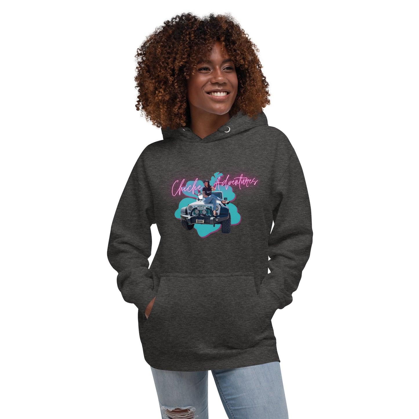 a woman wearing a black hoodie with a pink and blue design on it