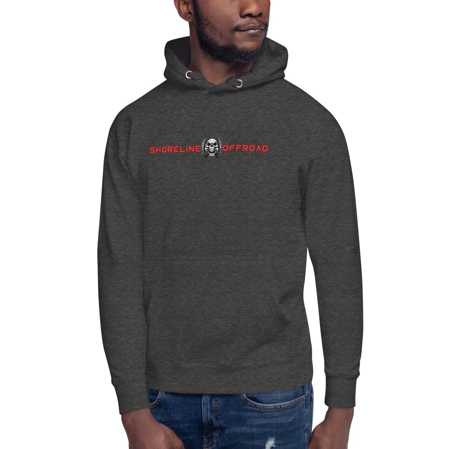 a man wearing a black hoodie with a skull on it