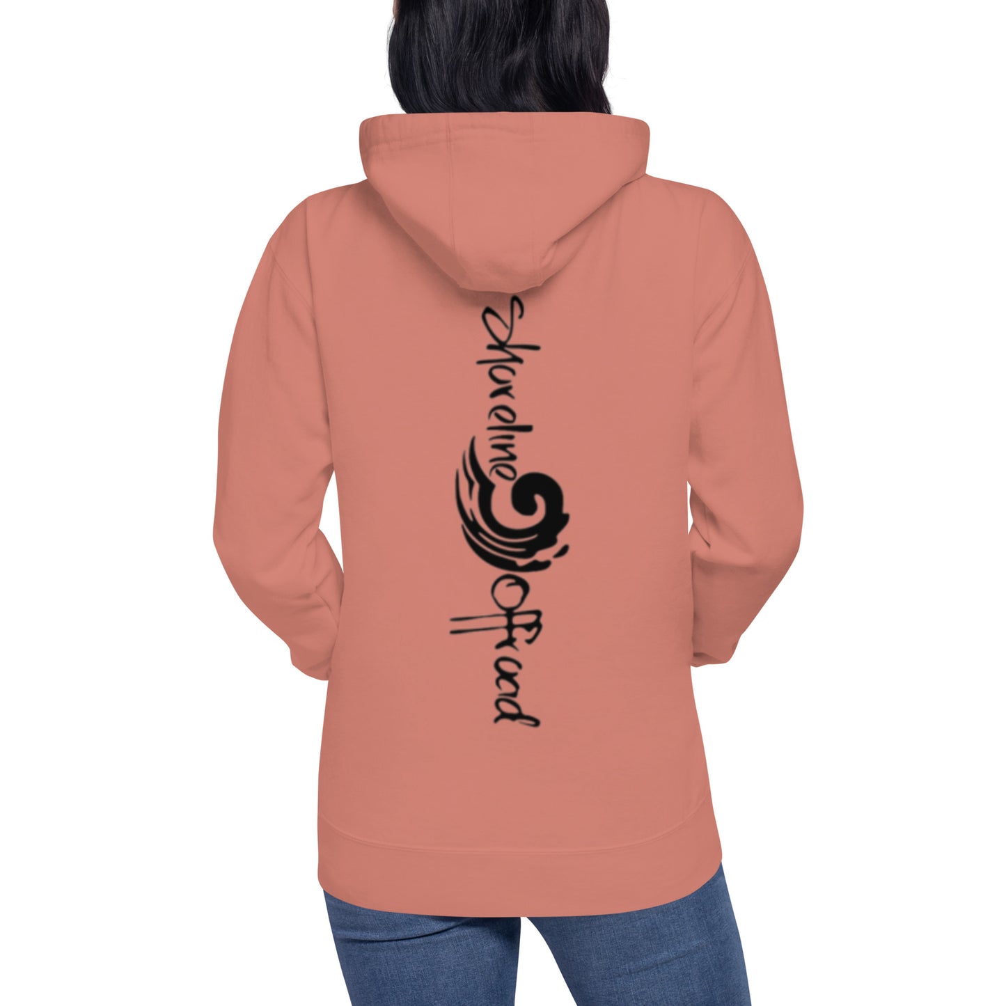 a woman wearing a pink hoodie with black lettering
