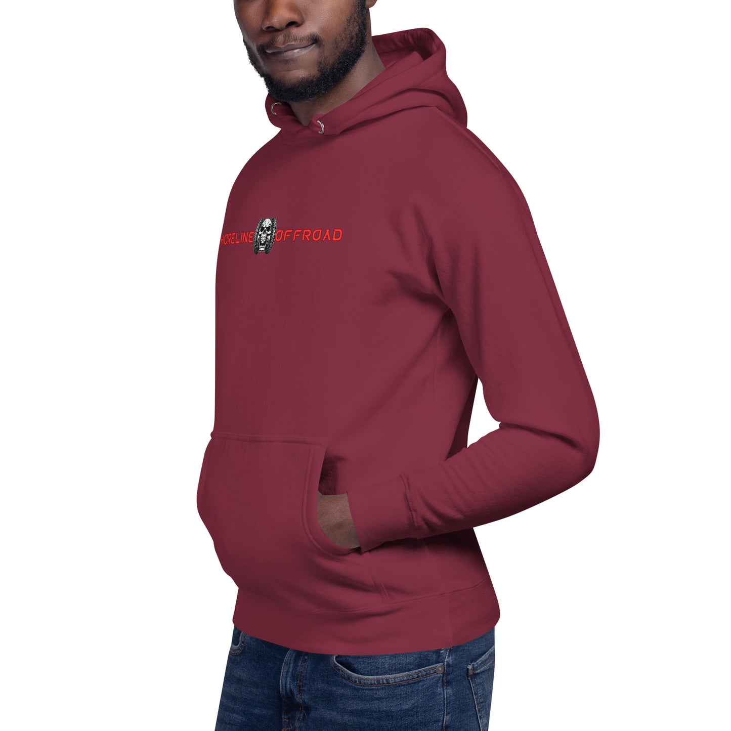 a man wearing a red hoodie with a skull on it