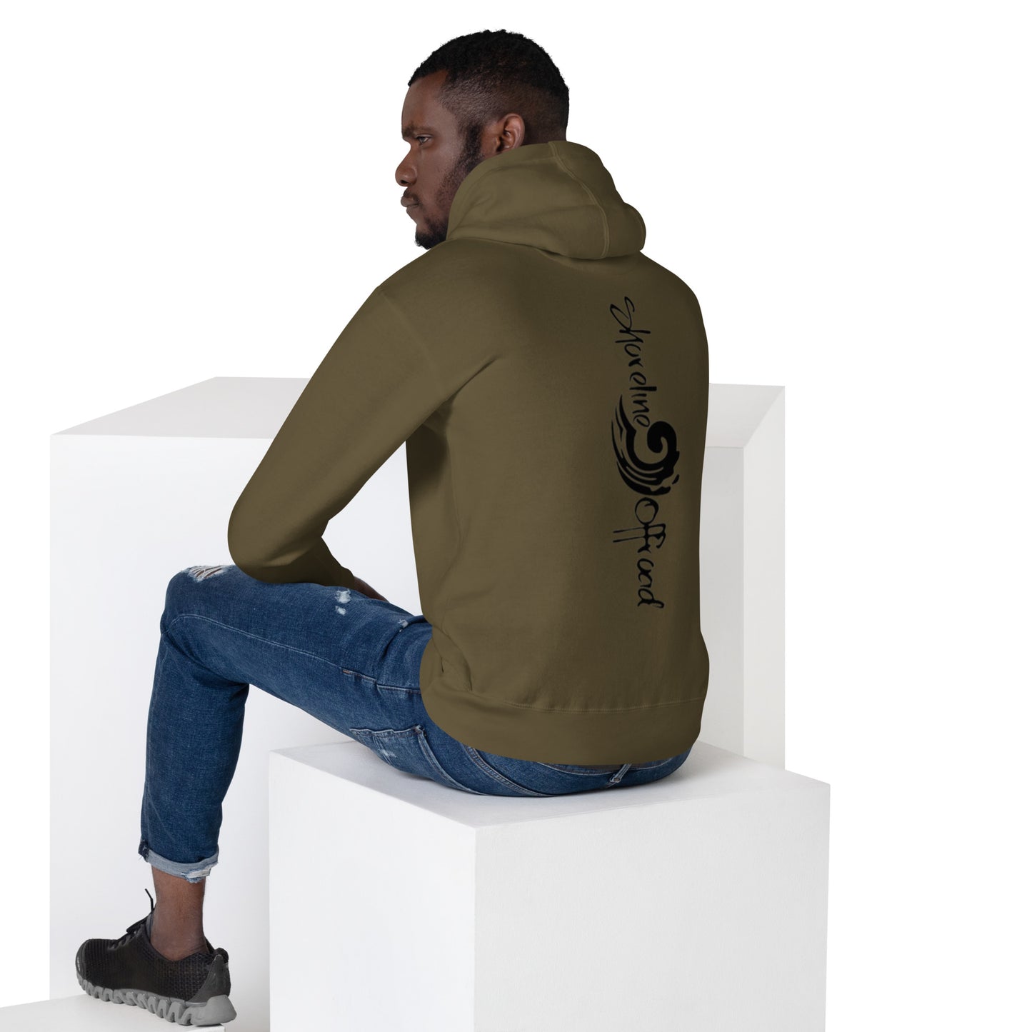 a man sitting on top of a white block