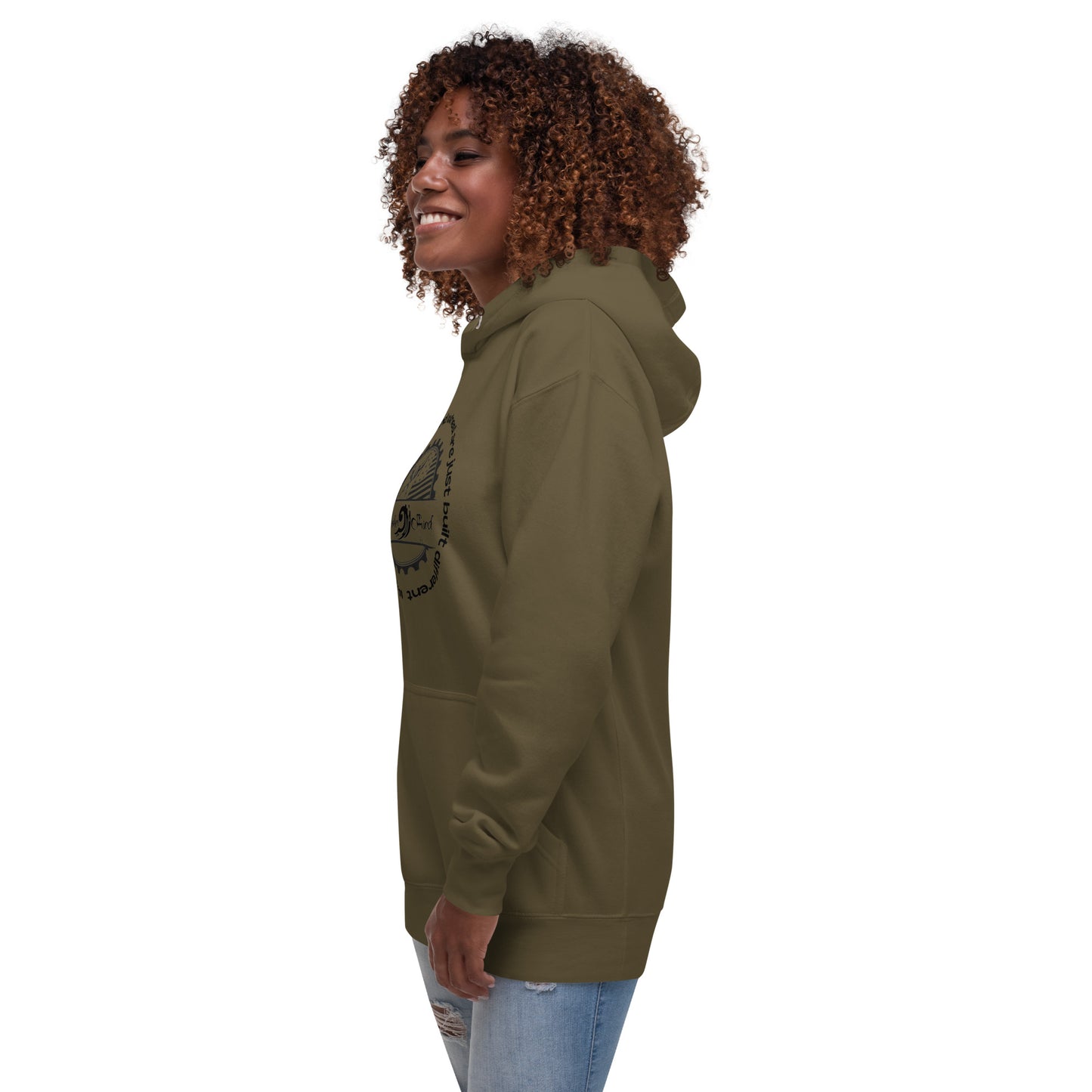 a woman with curly hair wearing a green hoodie
