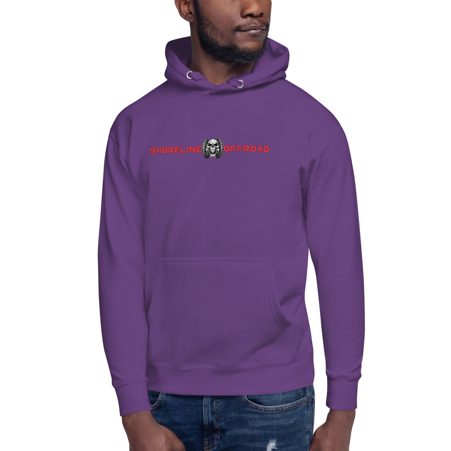 a man wearing a purple hoodie with a skull on it