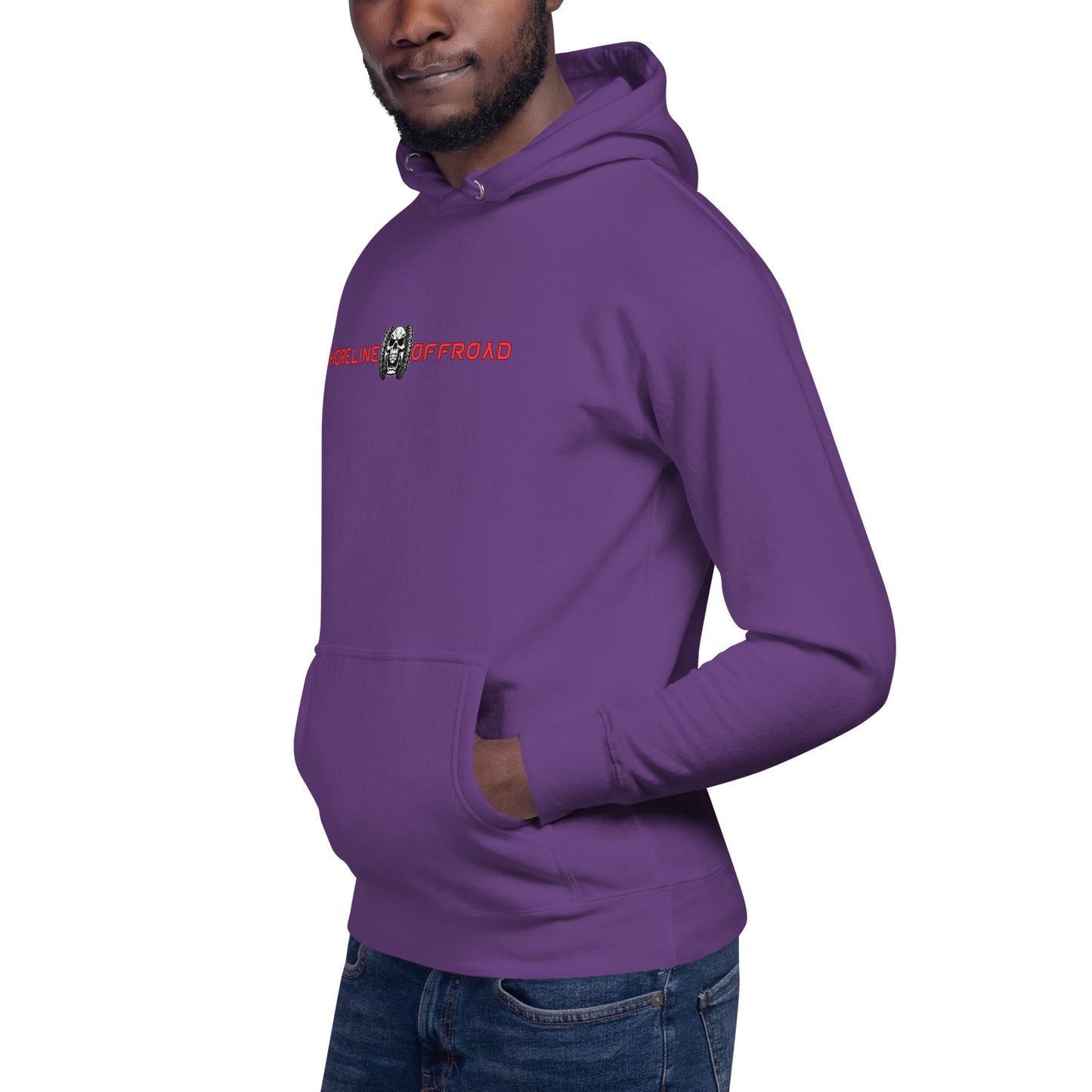a man wearing a purple hoodie with a skull on it