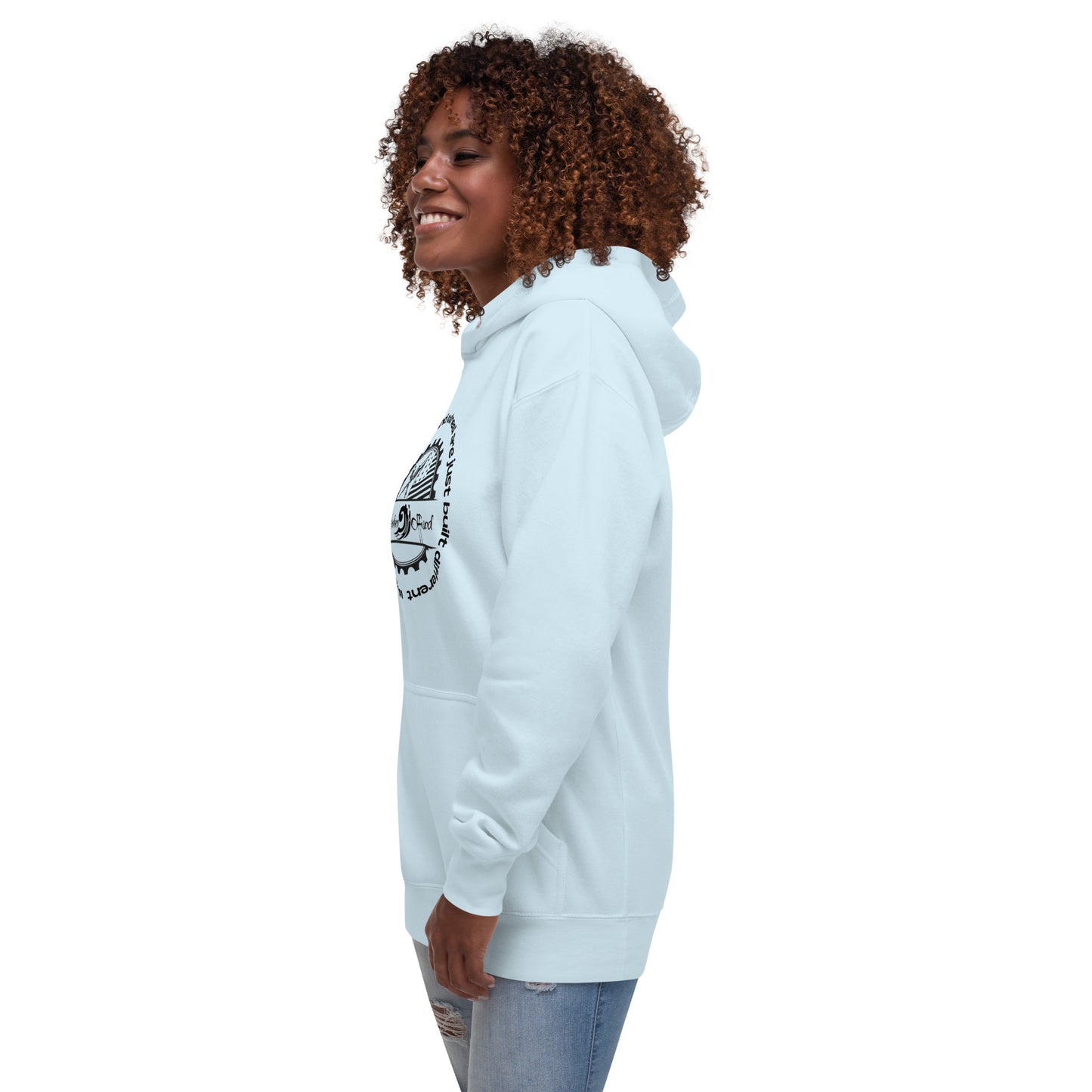 a woman wearing a white hoodie and jeans