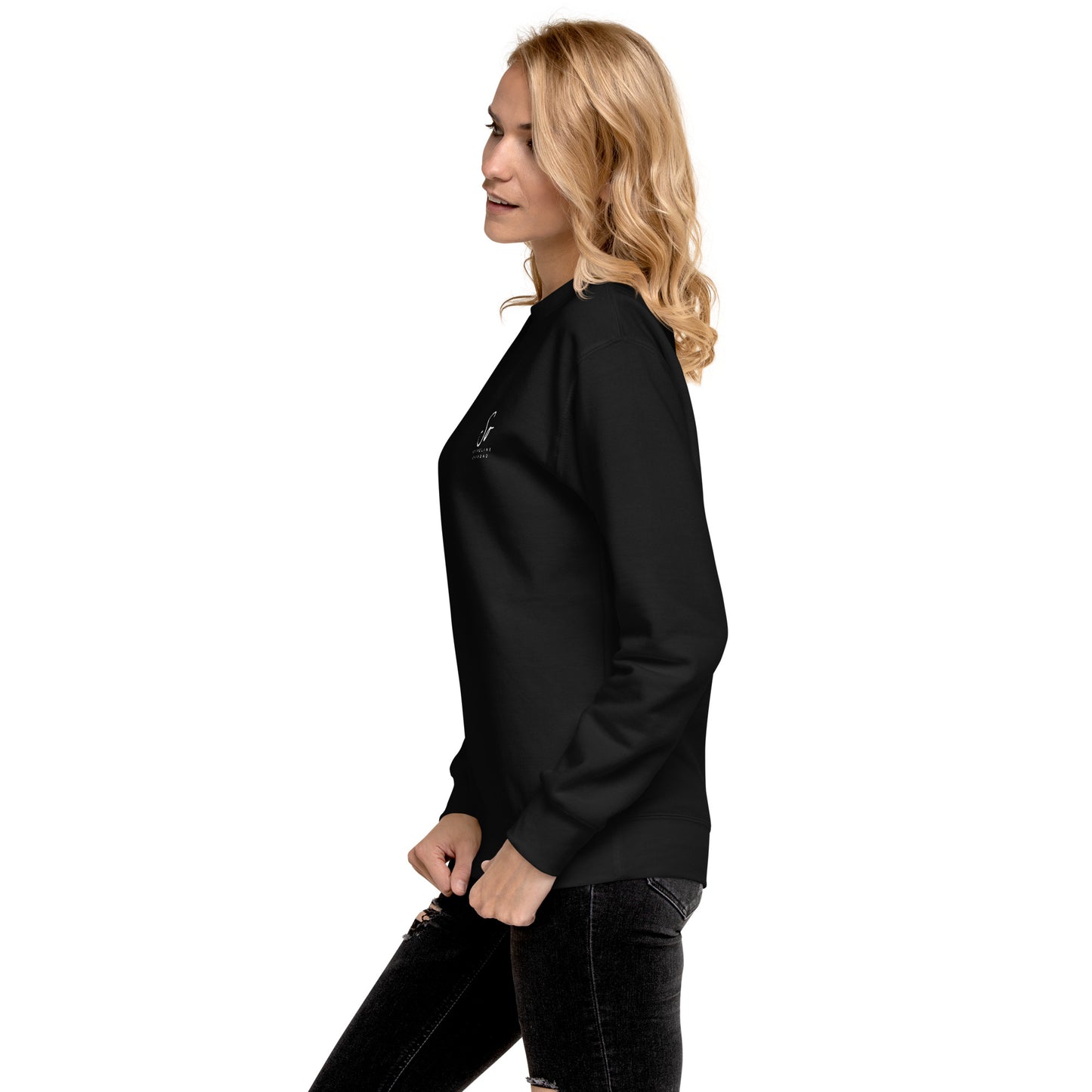 a woman wearing a black top and jeans
