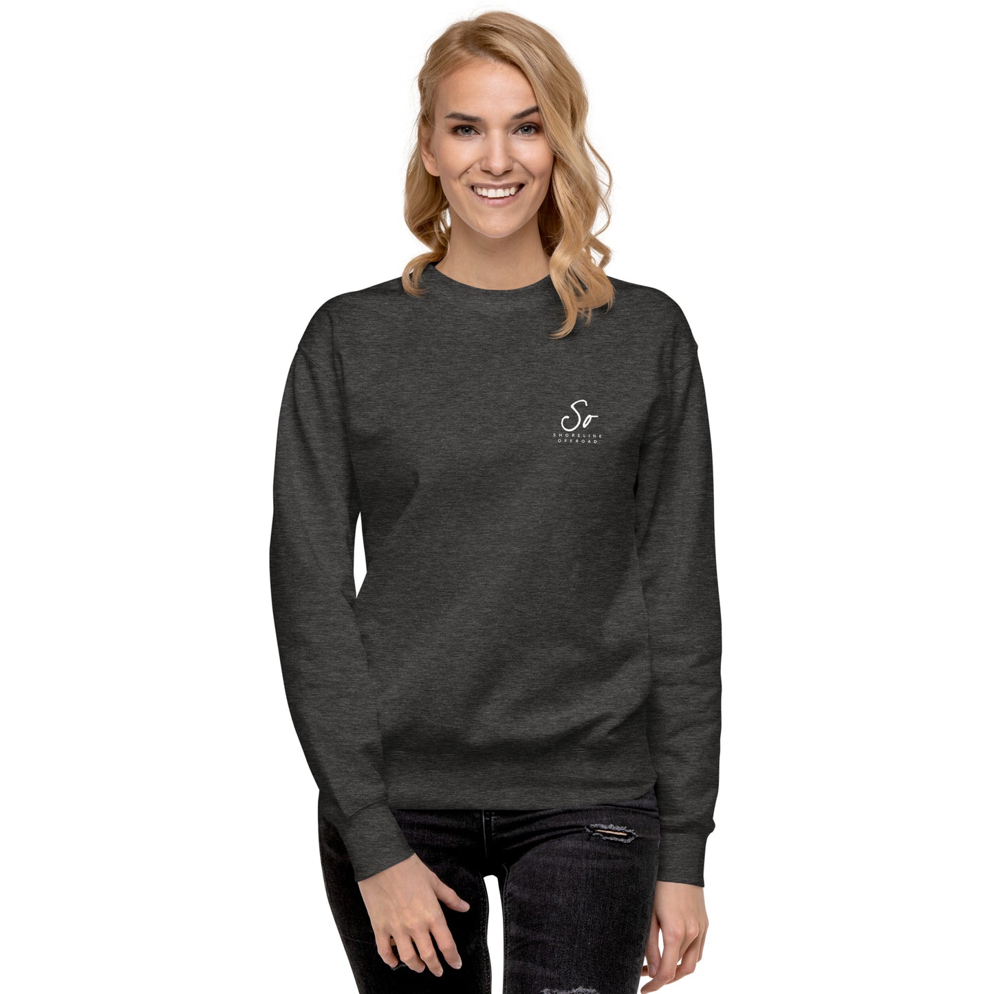 a woman wearing a black sweatshirt with the letter s on it