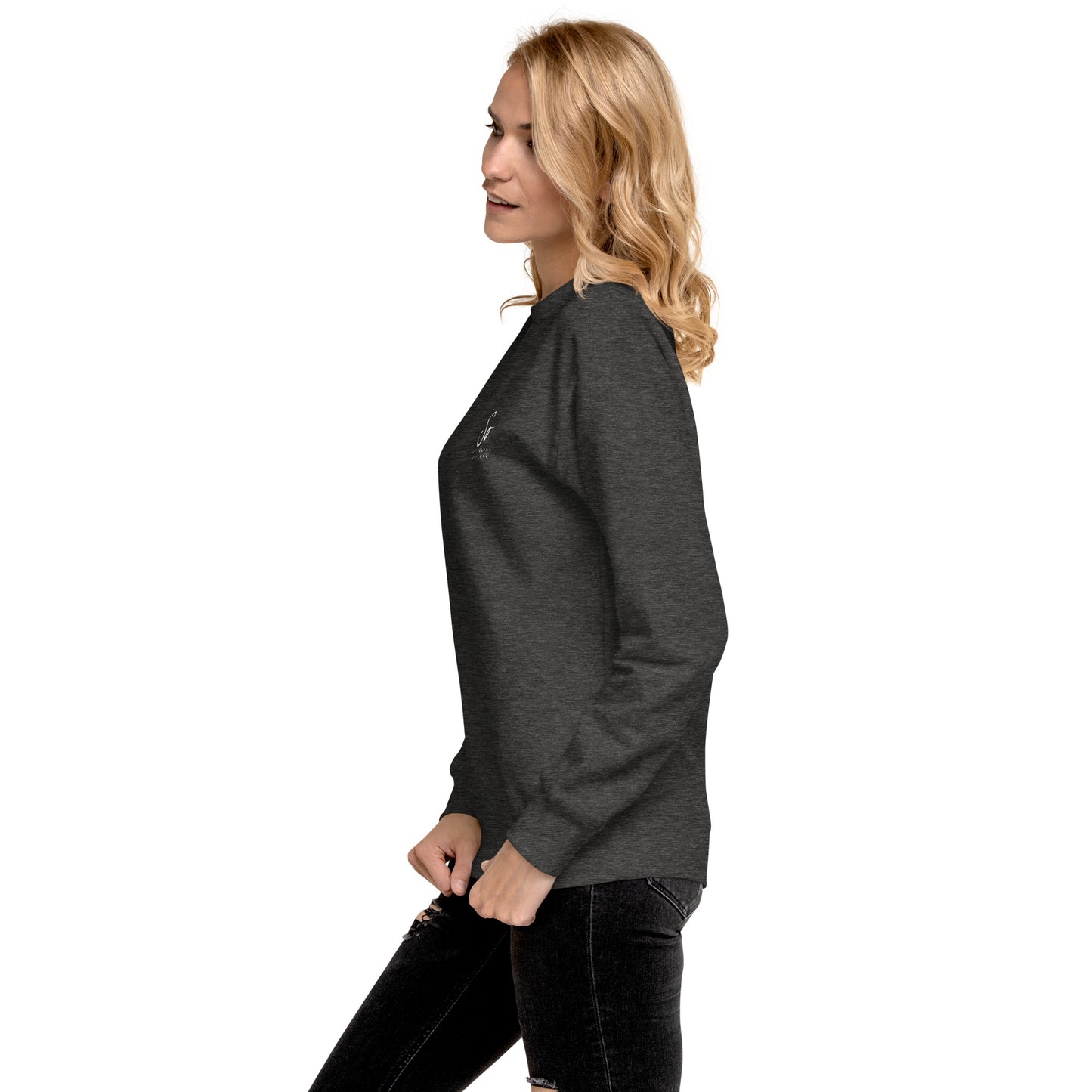 a woman in black jeans and a gray sweatshirt
