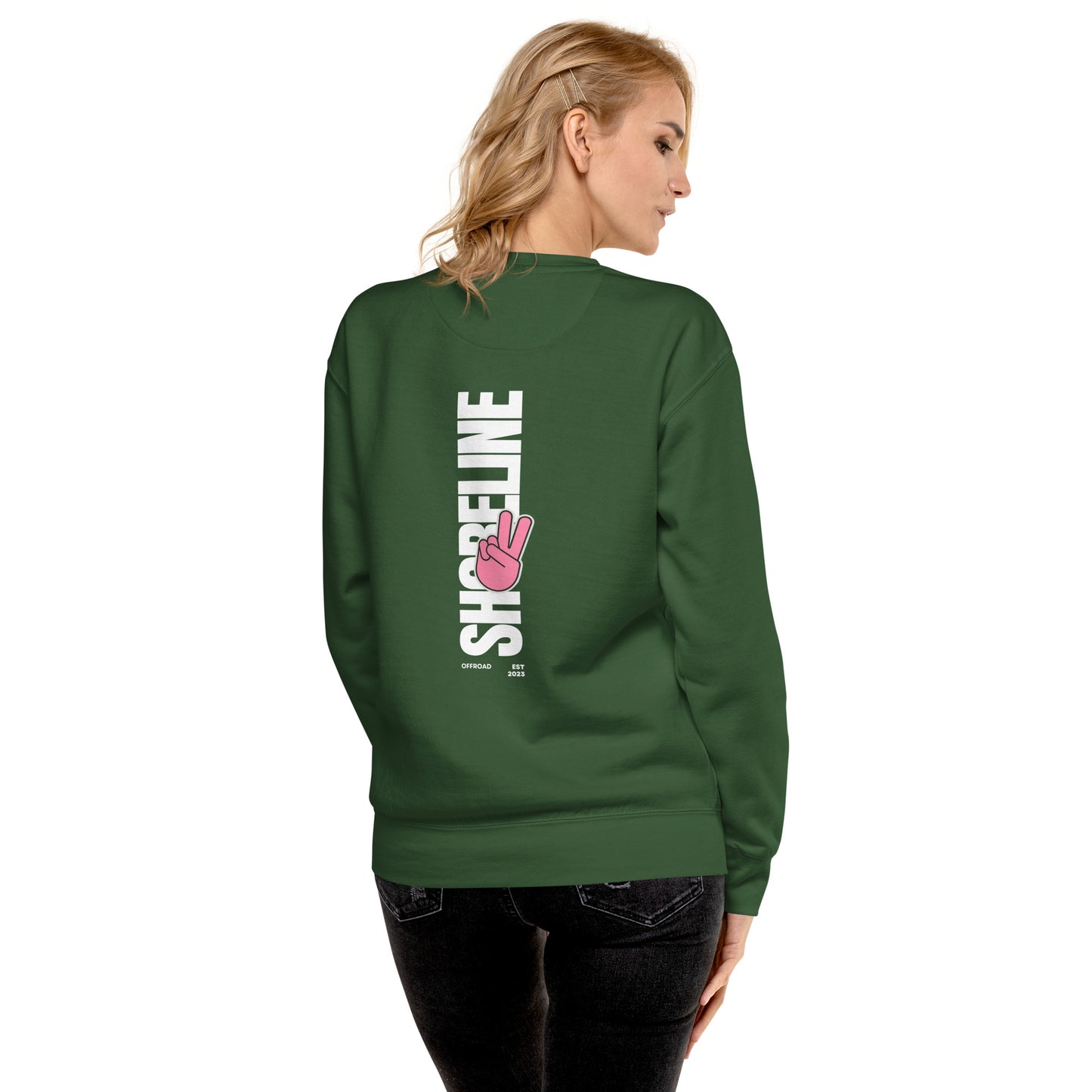 a woman wearing a green sweatshirt with the words streetline on it