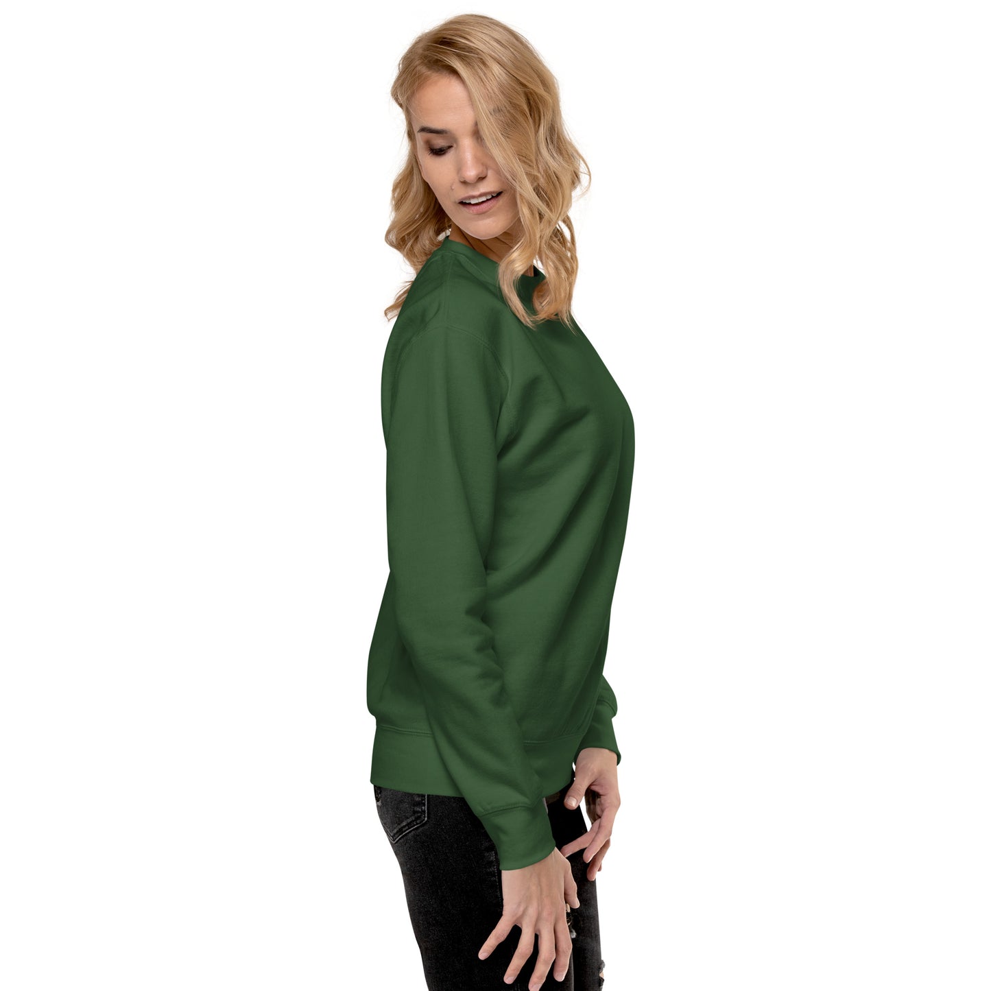 a woman wearing a green sweatshirt and black pants