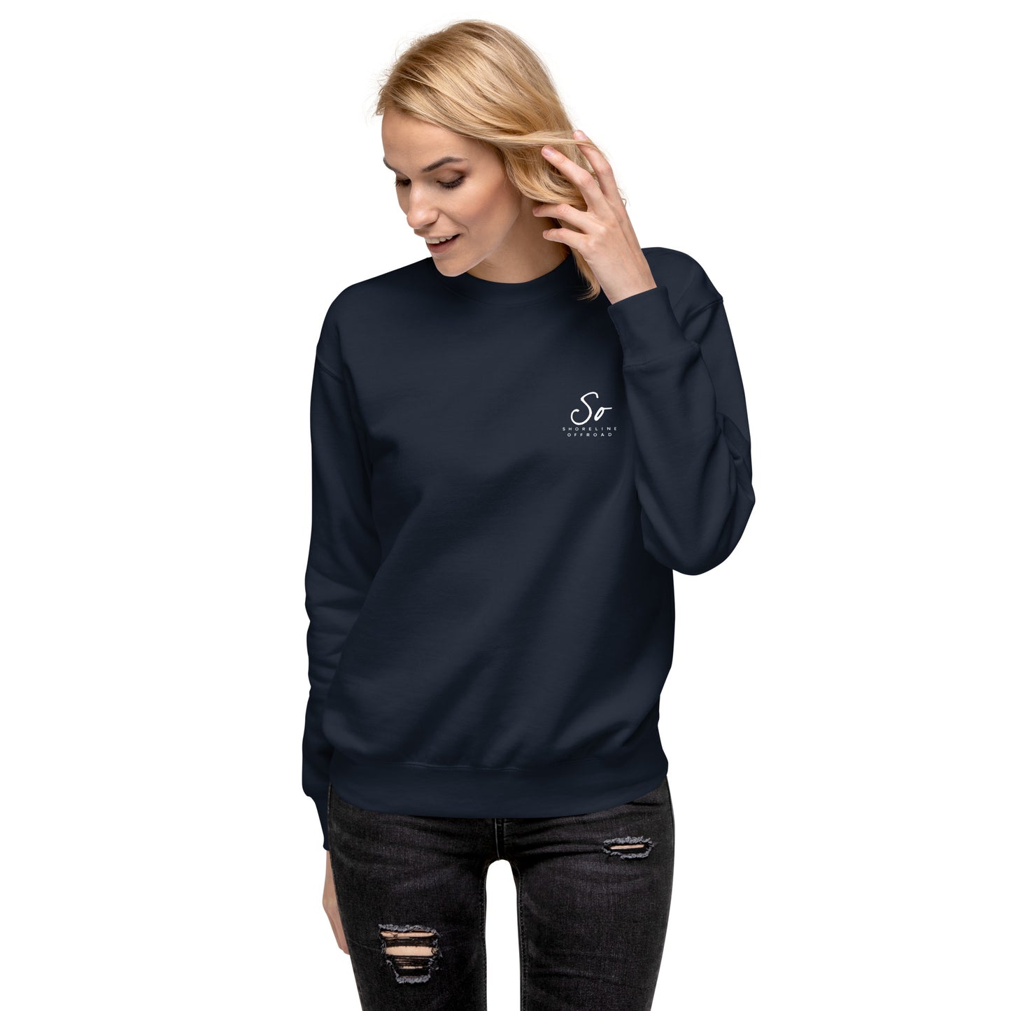 a woman wearing a dark blue sweatshirt with a white cat on it