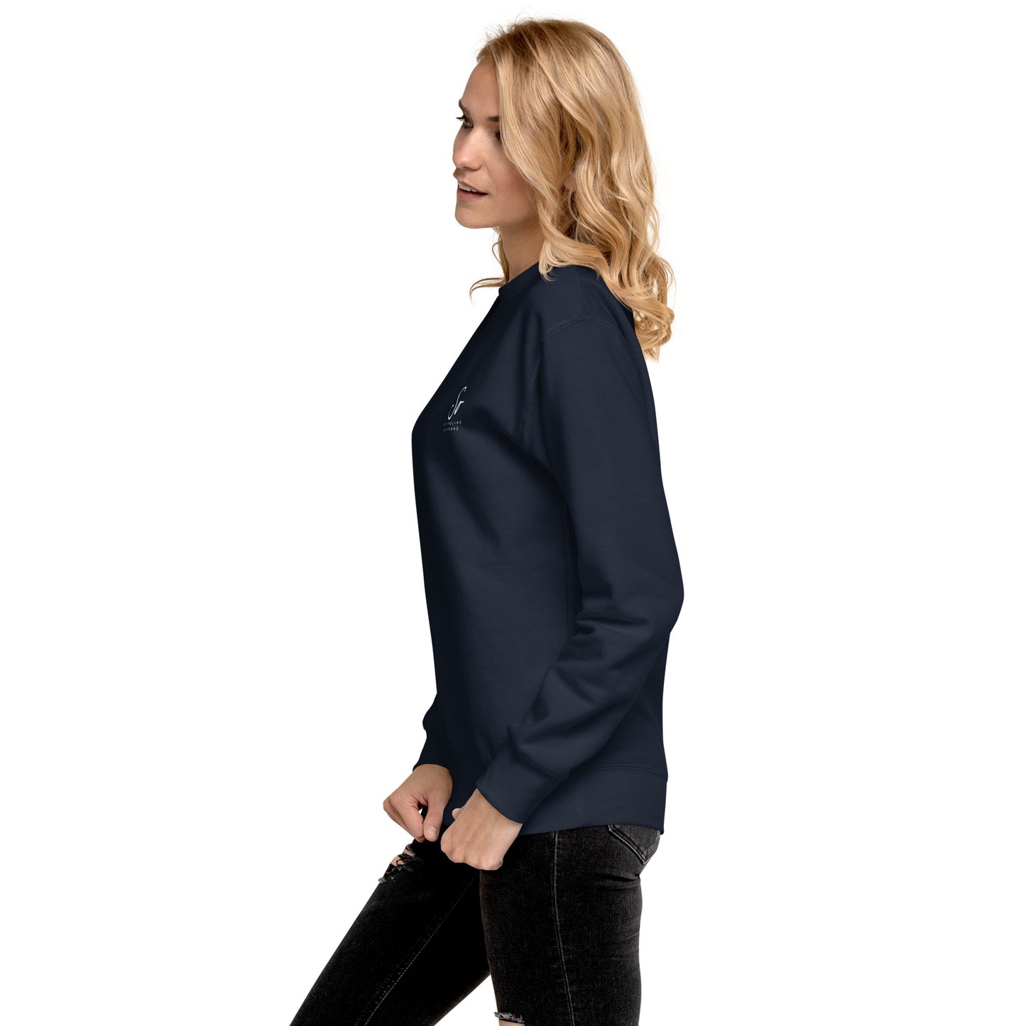 a woman in a blue top is standing