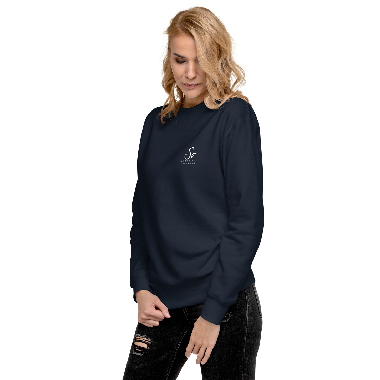 a woman wearing a blue sweatshirt with a white anchor on it