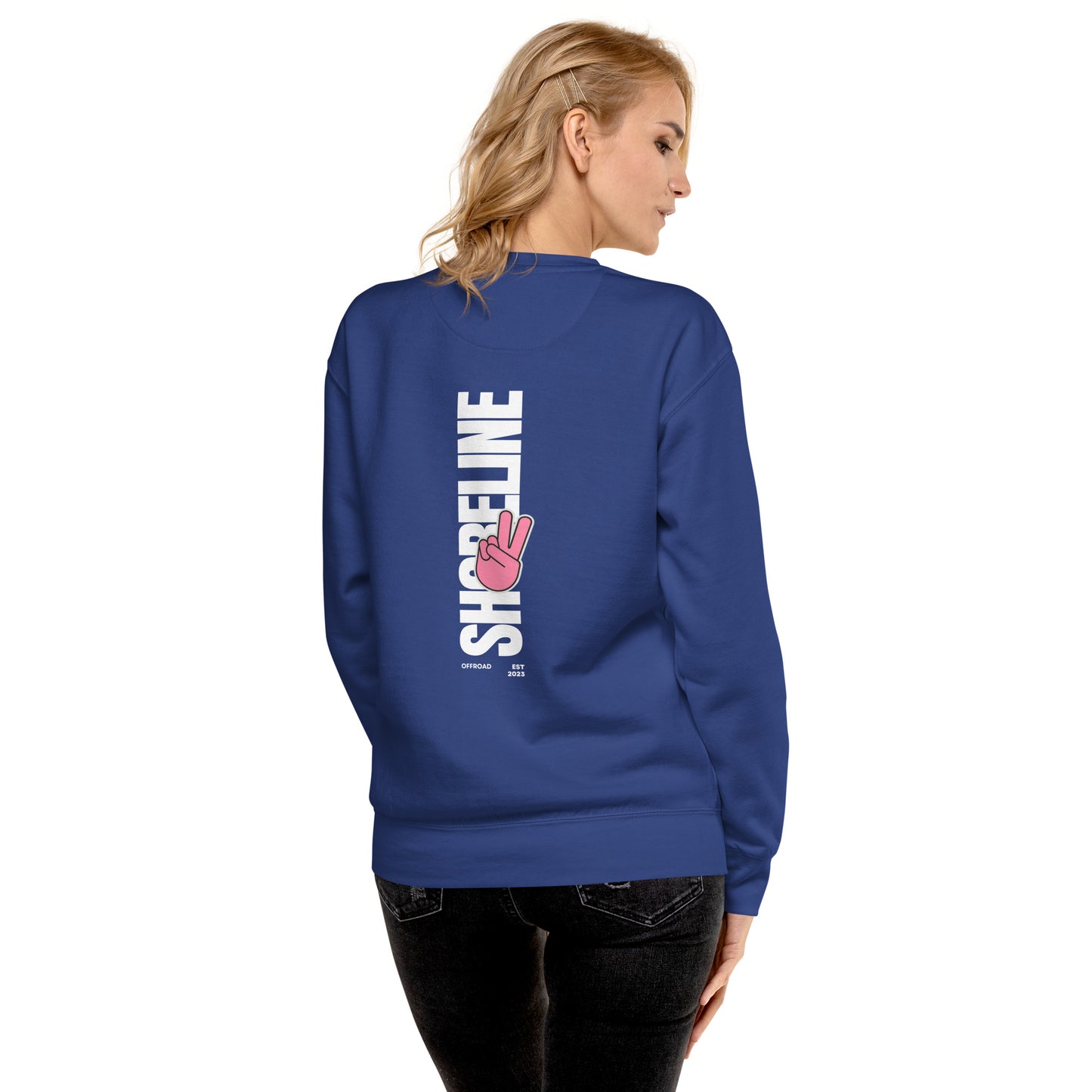 a woman wearing a blue sweatshirt with the words strikeline on it