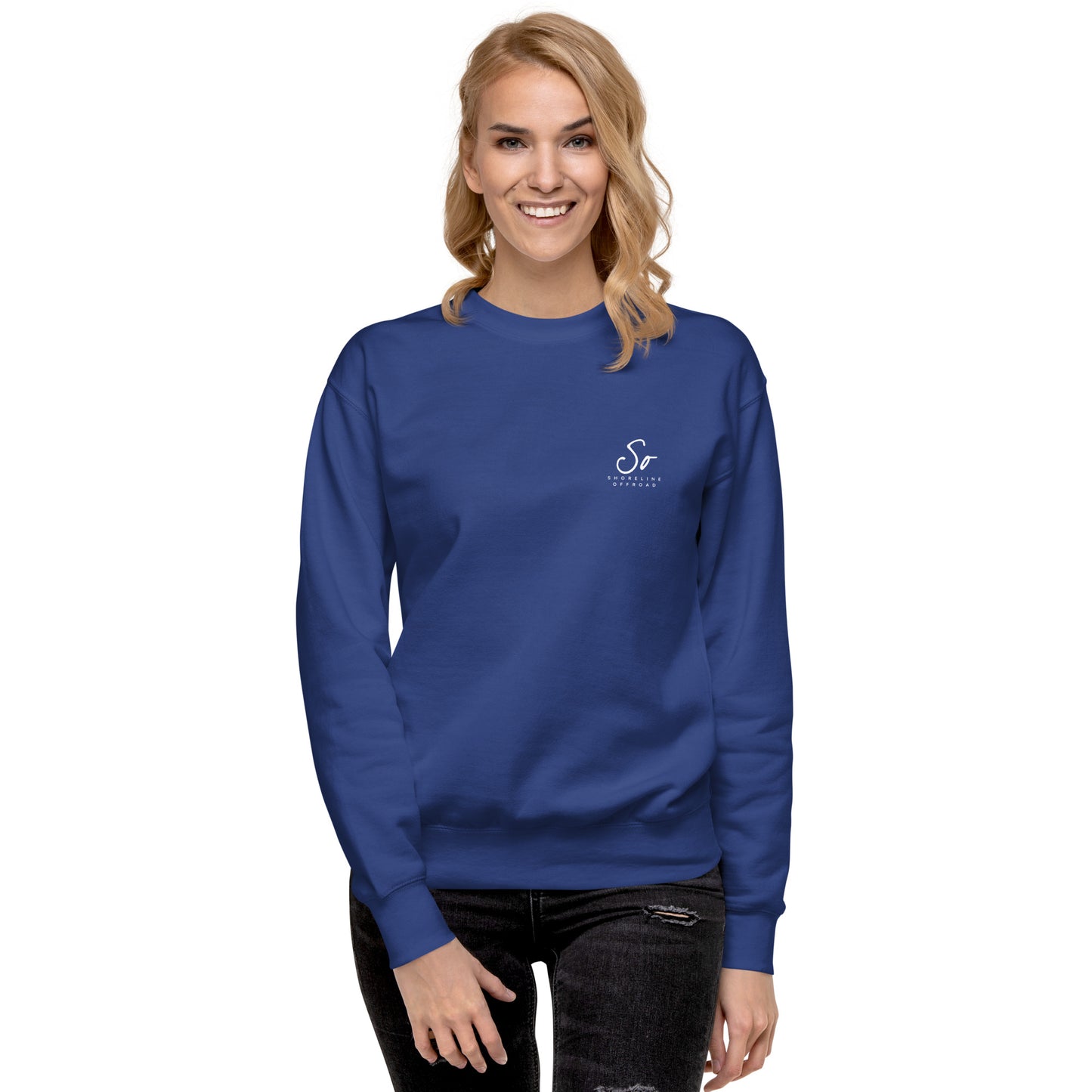 a woman wearing a blue sweatshirt with the letter s on it