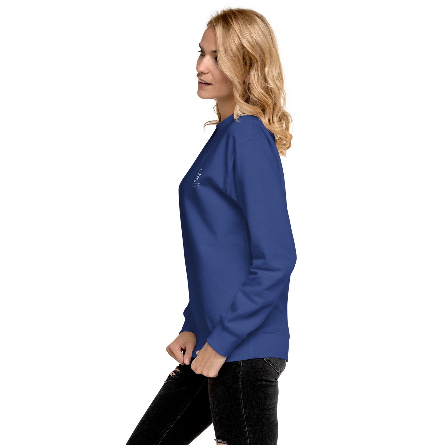 a woman in a blue shirt and black jeans