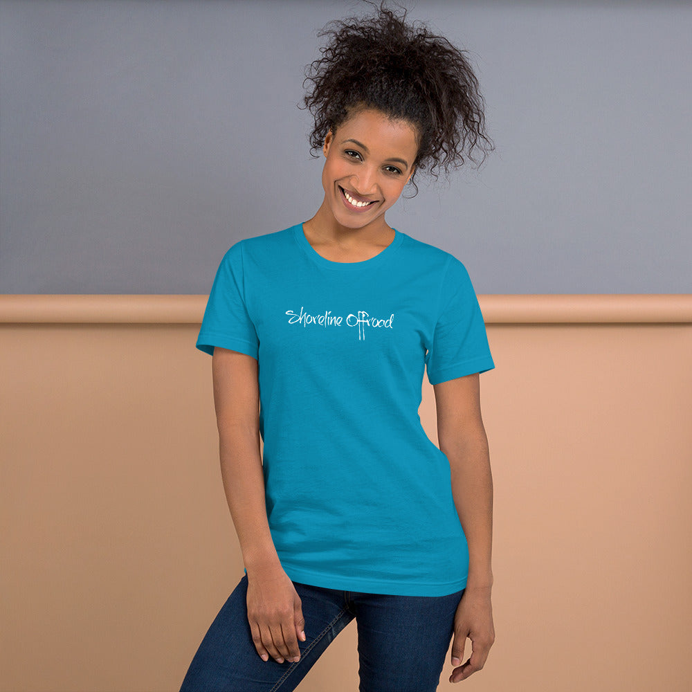 a smiling woman wearing a blue shirt with the words something ahead on it