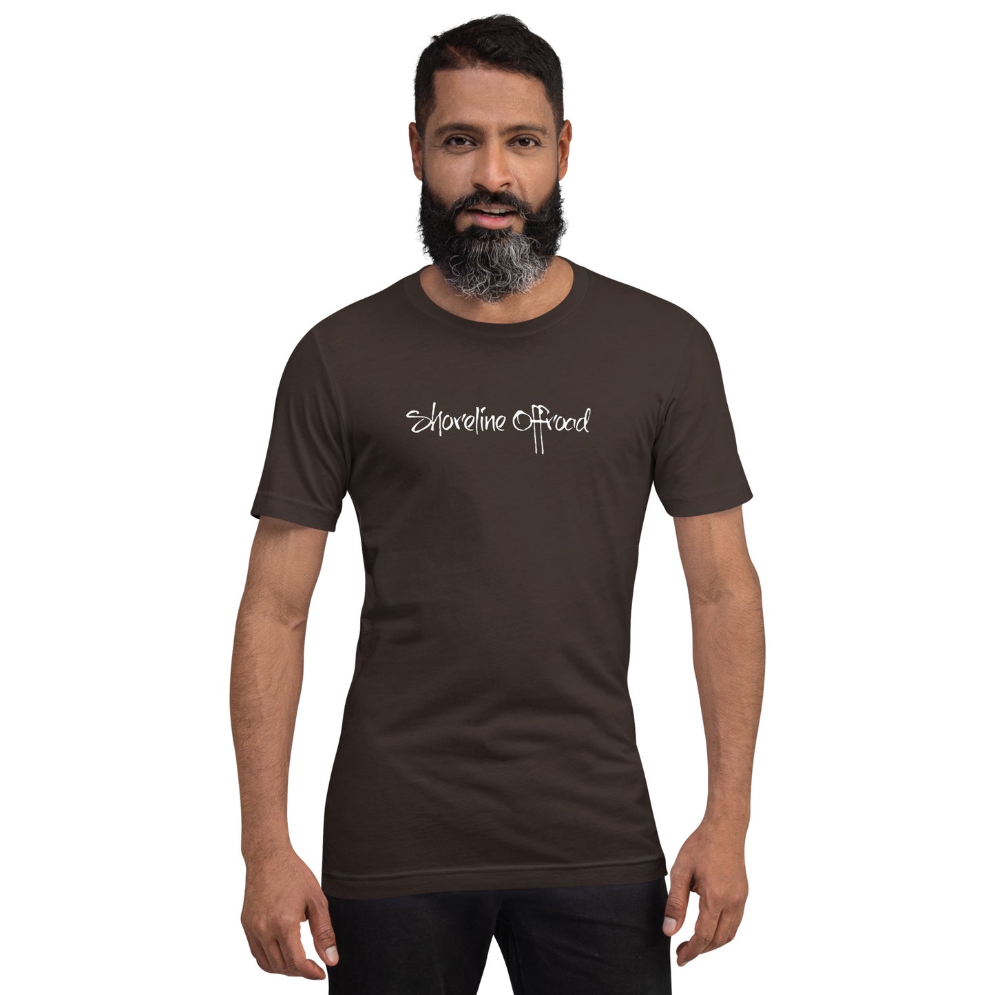 a man with a beard wearing a brown shirt