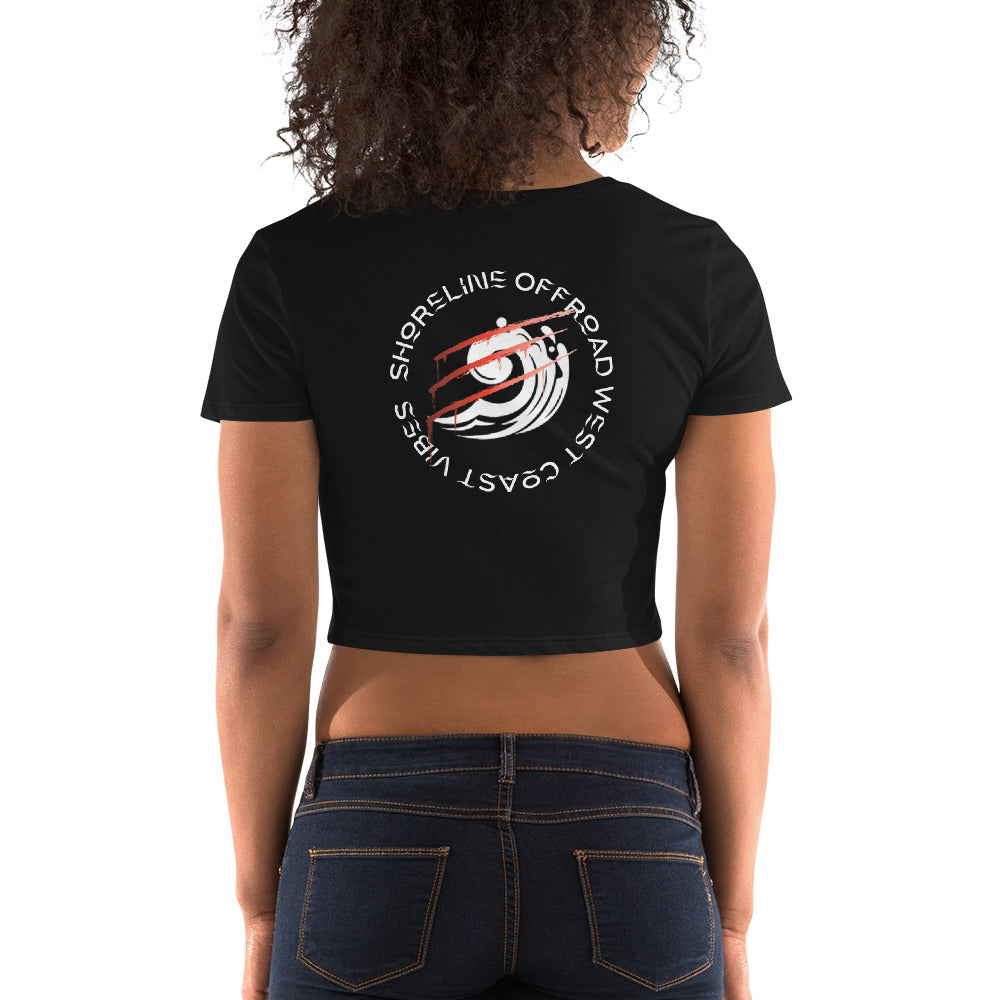 a woman wearing a black shirt with a red and white wave on it