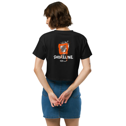 a woman wearing a black shirt with the words shoreline on it