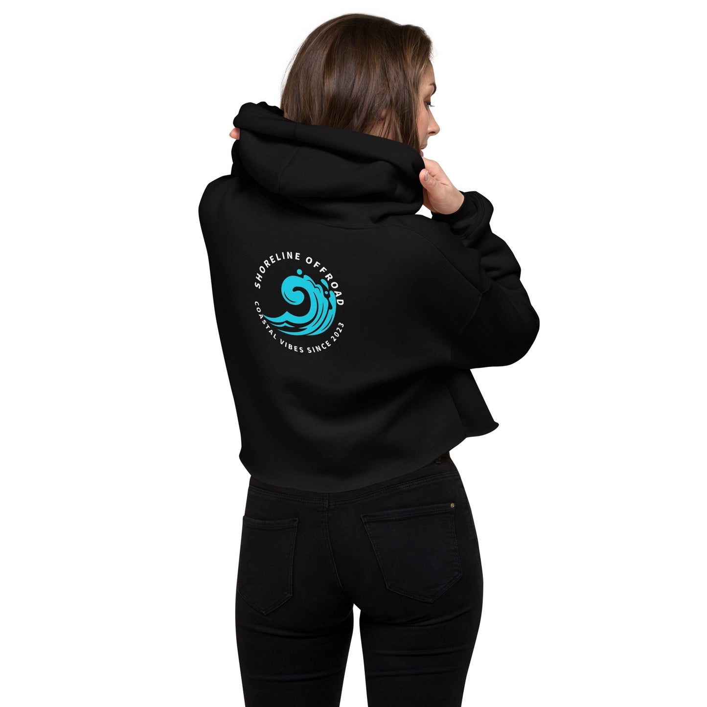 a woman wearing a black hoodie with a blue wave on it