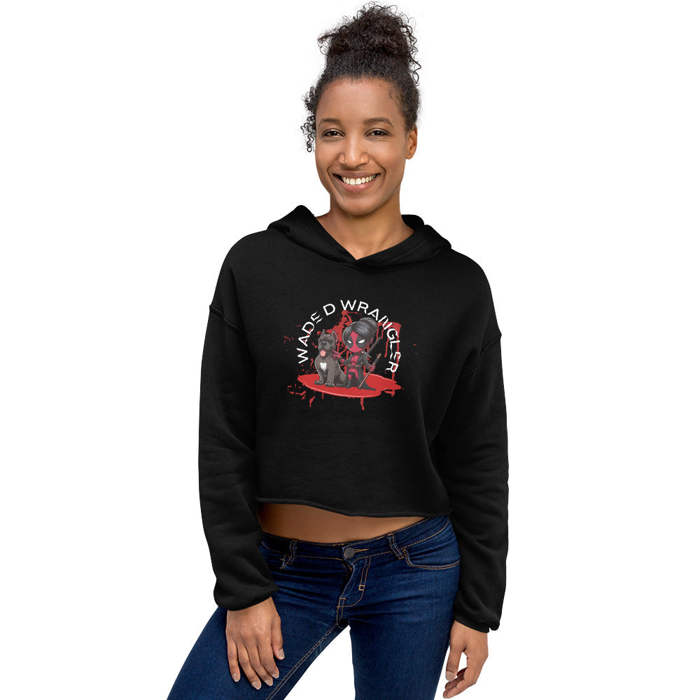 a woman wearing a black crop top and jeans