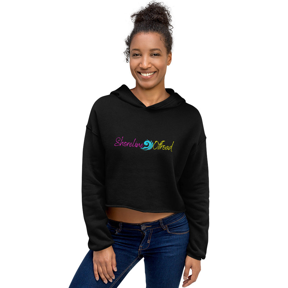 a woman wearing a black crop top with the words strong as a bird on it