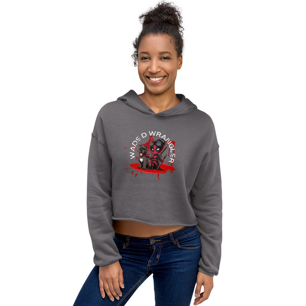 a woman wearing a grey crop top with a black dog on it