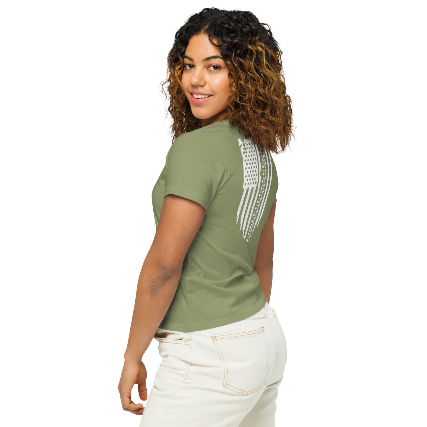 a woman wearing a green shirt and white pants