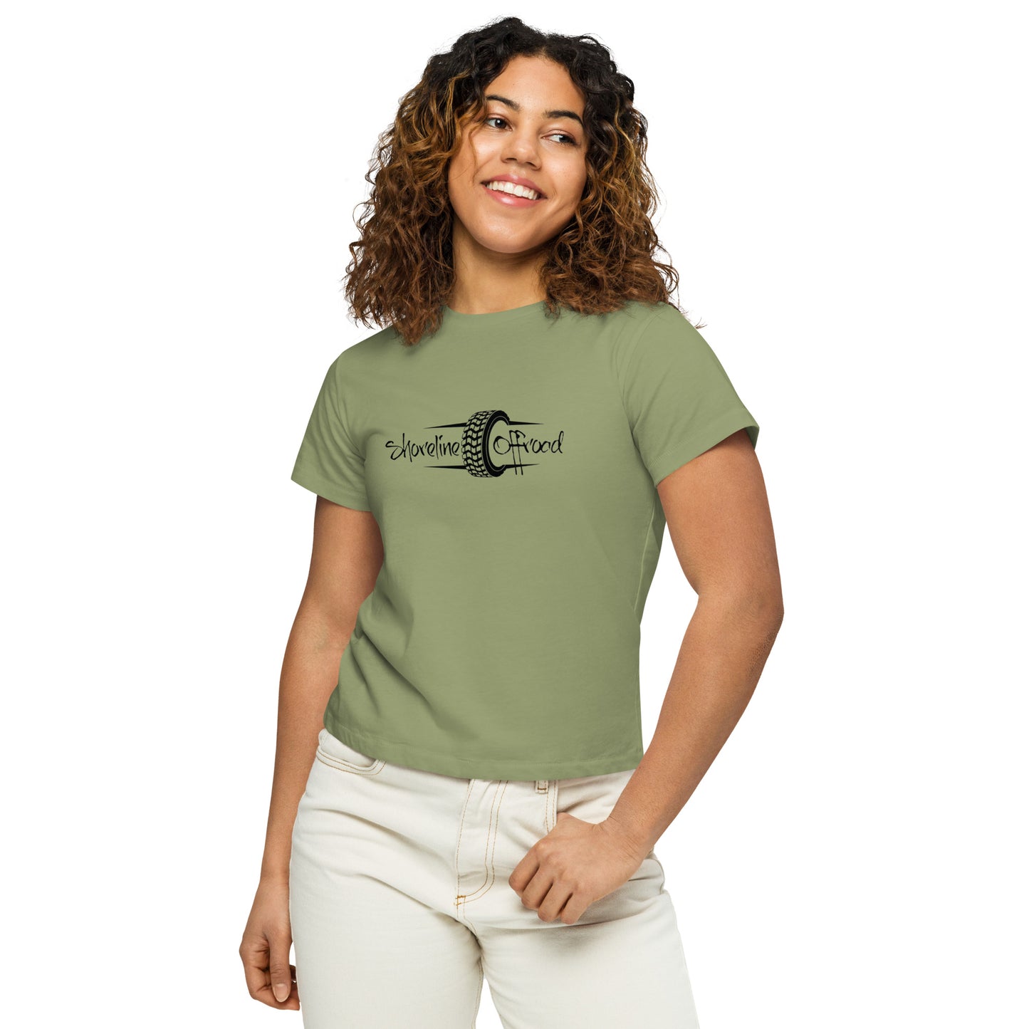 a woman wearing a green shirt and white pants